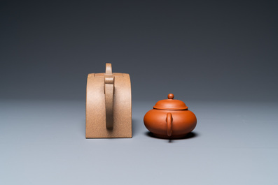 Two Chinese Yixing stoneware teapots with engraved inscriptions, 20th C.