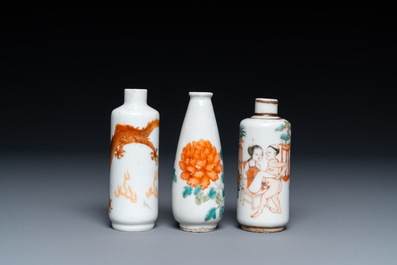 Three Chinese iron red and famille rose snuff bottles incl. one with an erotical subject, 19th C.