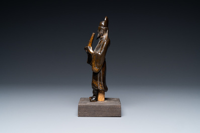 A Chinese partly gilt bronze figure of a scholar, Ming