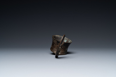 A Vietnamese bronze ladle depicting a musician, Dong Son, ca. 5th/2nd C. BC