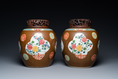 A pair of Chinese famille rose capucin brown-ground jars, Qianlong
