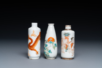 Three Chinese iron red and famille rose snuff bottles incl. one with an erotical subject, 19th C.