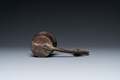 A Vietnamese bronze ladle depicting a musician, Dong Son, ca. 5th/2nd C. BC