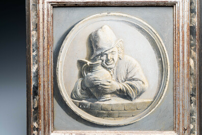 A polychrome Brussels faience oval molded plaque and a matching grisaille painting on copper of a man with a jug, early 19th C.