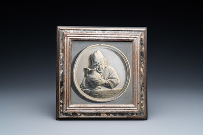 A polychrome Brussels faience oval molded plaque and a matching grisaille painting on copper of a man with a jug, early 19th C.