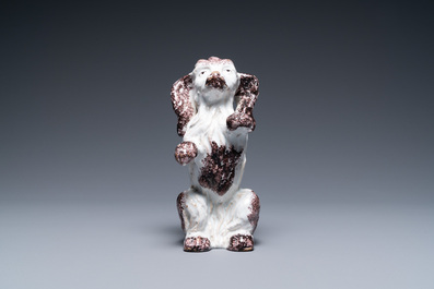A Brussels faience manganese and white dog, 18th C.