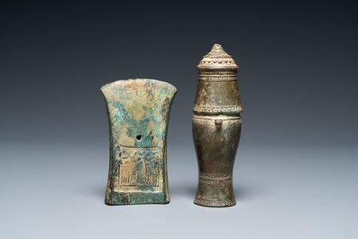 A Vietnamese bronze axe head, Dong Son, 3rd/1st C. BC and a small lime jar, L&ecirc; Dynasty, 15th C.