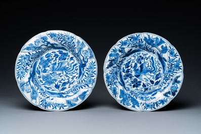 A pair of Chinese blue and white lobed 'phoenix and monkey' plates, Kangxi