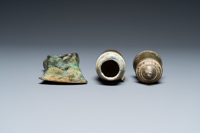 A Vietnamese bronze axe head, Dong Son, 3rd/1st C. BC and a small lime jar, L&ecirc; Dynasty, 15th C.