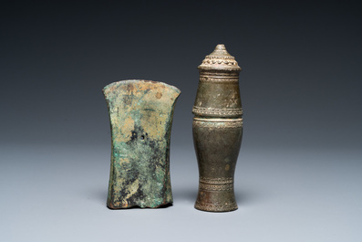 A Vietnamese bronze axe head, Dong Son, 3rd/1st C. BC and a small lime jar, L&ecirc; Dynasty, 15th C.