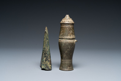 A Vietnamese bronze axe head, Dong Son, 3rd/1st C. BC and a small lime jar, L&ecirc; Dynasty, 15th C.