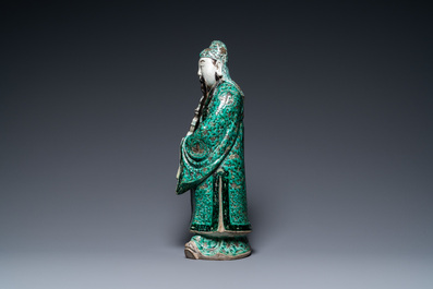 A Chinese verte biscuit figure of an immortal, 19th C.