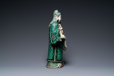 A Chinese verte biscuit figure of an immortal, 19th C.