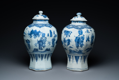 A pair of Chinese blue and white vases and covers with narrative design, Transitional period