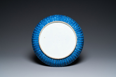 A Chinese ribbed blue and white dish with a scholar and his pupil, 19th C.