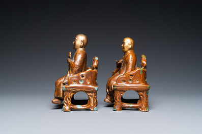 A pair of Chinese partly gilded seated figures, Zeng Long Sheng Zao mark, 20th C.
