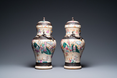 A pair of Chinese famille rose Nanking crackle-glazed vases and covers, Chenghua mark, 19th C.