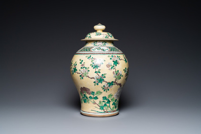 A Chinese yellow-ground verte biscuit vase and cover, 19th C.