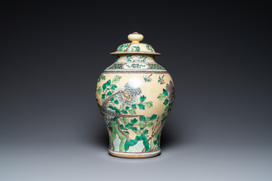 A Chinese yellow-ground verte biscuit vase and cover, 19th C.