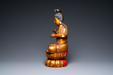 A large Vietnamese or Japanese gilded and lacquered wooden Buddha on lotus throne, 19th C.