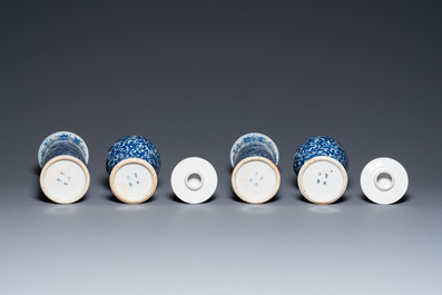 A Chinese blue and white four-piece garniture, Kangxi mark, 19th C.