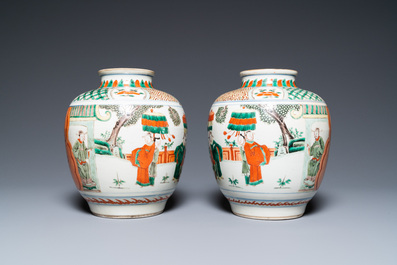 A pair of Chinese famille verte vases on wooden stands, 'hare' mark, 19th C.