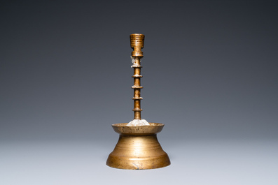 A Flemish or Dutch knotted bronze candlestick, 15th C.