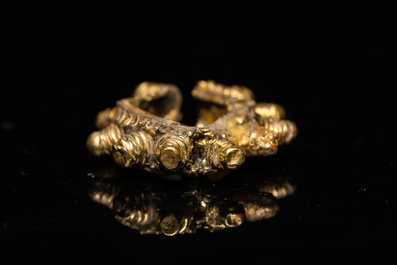 Three Vietnamese golden earrings, Champa, 14th C. and a pair of later Chinese gilded earrings, 18/19th C.