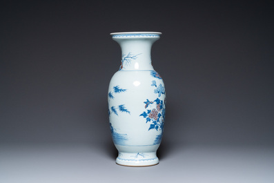 A Chinese blue, white and copper-red vase, 18/19th C.