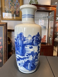A Chinese blue and white rouleau vase with figures in a mountainous landscape, Kangxi