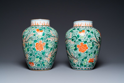 A pair of Chinese famille verte 'phoenix' vases, 19th C.