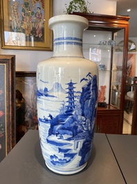 A Chinese blue and white rouleau vase with figures in a mountainous landscape, Kangxi
