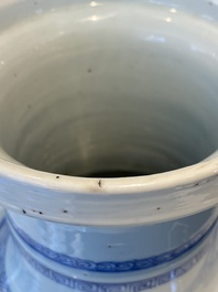 A Chinese blue and white rouleau vase with figures in a mountainous landscape, Kangxi