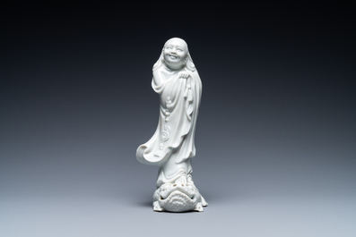 A Chinese Dehua blanc de Chine figure of Liu Hai with the toad, Kangxi