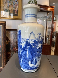 A Chinese blue and white rouleau vase with figures in a mountainous landscape, Kangxi