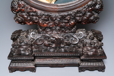 A pair of Chinese wooden table screens with soapstone- and bone-embellished medallions, 18/19th C.