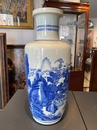 A Chinese blue and white rouleau vase with figures in a mountainous landscape, Kangxi