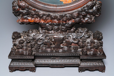 A pair of Chinese wooden table screens with soapstone- and bone-embellished medallions, 18/19th C.