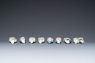 Eight Chinese blue, white and celadon-glazed figures, Qianlong