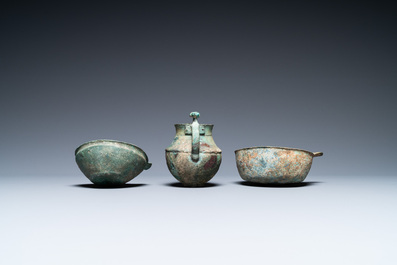 Two Luristan bronze pouring bowls and a spouted vessel, Iran, 1st millenium BC