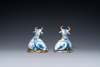 A pair of polychrome Dutch Delft cow-shaped tureens, 18th C.