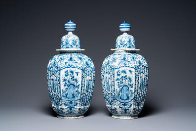 A pair of large ribbed Dutch Delft blue and white covered vases, 1st quarter 18th C.