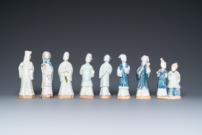 Eight Chinese blue, white and celadon-glazed figures, Qianlong