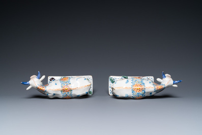 A pair of polychrome Dutch Delft cows on bases with frogs, 18th C.