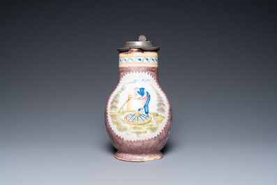 A polychrome Brussels faience ewer with a wheelwright, 18th C.