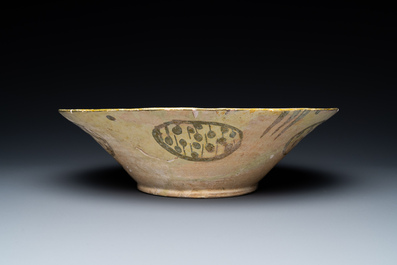 A large Nishapur 'imitation lustre' pottery bowl with a bird, Persia, 10th C.