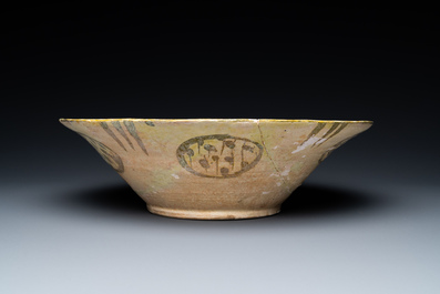 A large Nishapur 'imitation lustre' pottery bowl with a bird, Persia, 10th C.