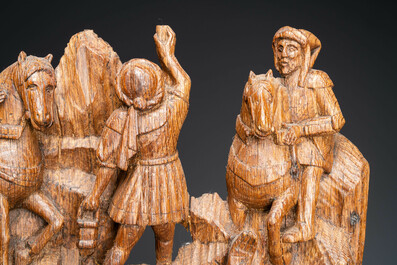 A Flemish carved oak retable fragment: 'Roman soldiers on mount Golgotha', ca. 1500