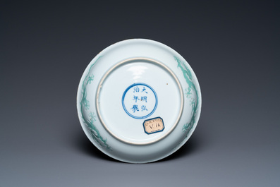 A Chinese incised and green-glazed 'dragon' dish, Hongzhi mark, Ming
