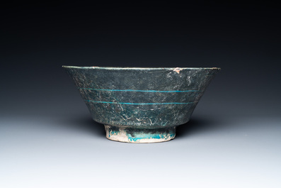 A turquoise- and black-glazed bowl, Kashan, Iran, 12/13th C.